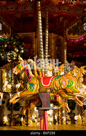 Gallopers, carved wooden horses on a roundabout or carousel in Edinburgh Stock Photo