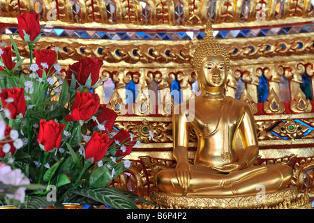 Buddha statue in buddhist temple in Bangkok's chinatown, Thailand. The Buddha image is in the Subduing Mara position. Stock Photo