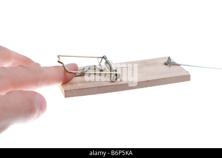 Mans hand catched in mousetrap over white Stock Photo
