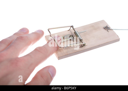 Mans hand catched in mousetrap over white Stock Photo