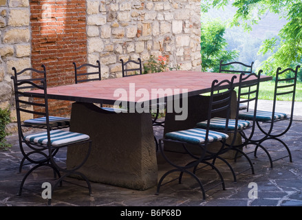 Outdoor stone table and chairs in Tuscany, Italy Stock Photo