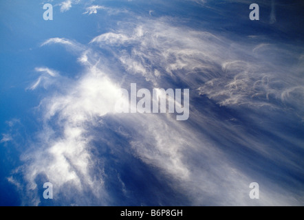 Dramatic wispy white clouds against a blue sky Stock Photo