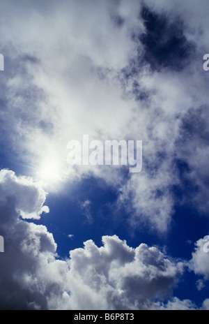 Blue sky background with white dramatic colorful clouds and sunlight ...
