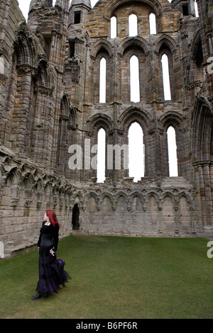 Whitby Goths Festival. A Goth pausing in the ruins of the old abbey .Goths from all over Europe gather for the Goths festival Stock Photo