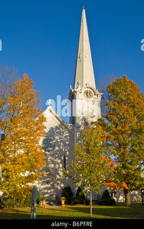 Autumn fall colours around traditional white timber clad church Manchester Vermont USA United States of America Stock Photo