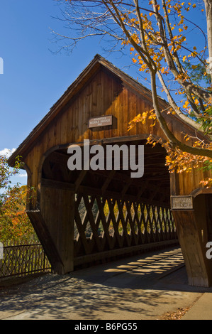 Autumn fall colours around traditional timber covered bridge middle bridge Woodstock Vermont USA United States of America Stock Photo