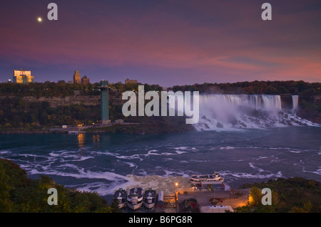 Full moon over the American Falls waterfall at Buffalo New York State USA from Niagara Ontario Canada Stock Photo