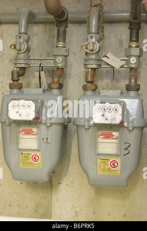 meters for measuring natural gas usage in multi-unit residential building Stock Photo