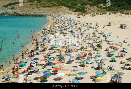 tourists at crowded sandy beach Cala Mesquida, Spain, Balearen, Majorca Stock Photo