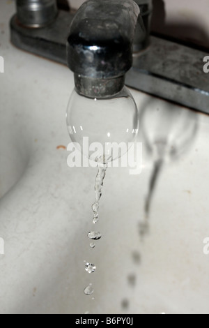 Air bubble from water tap. Stock Photo