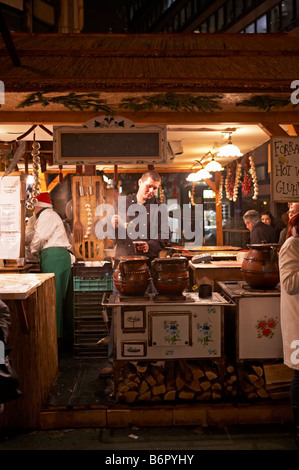 Budapest Christmas market Vorosmarty square gluvine seller Hungary Stock Photo