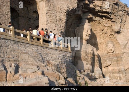 Chinese tourists visiting the site of the  ancient 53 Buddha carved sandstone caves in Yungang Grottoes, near Datong, China Stock Photo