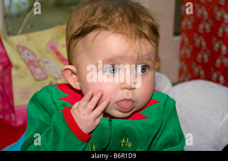 Baby Girl child in a Pixie Costume with Her Tongue Out Stock Photo