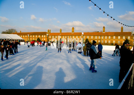 Skaters at Hampton Court Palace Outdoor xmas Ice Skating Rink Stock Photo