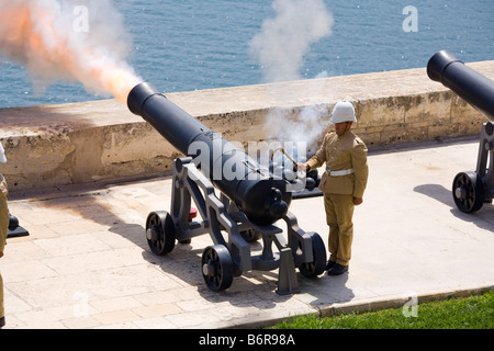 Firing of the noon day gun, at the Saluting Battery, Upper Barracca Gardens, Valletta, Malta Stock Photo