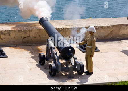 Firing of the noon day gun, at the Saluting Battery, Upper Barracca Gardens, Valletta, Malta Stock Photo