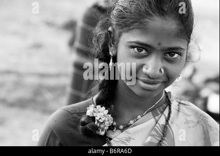 Poor nomadic indian teenage girl portrait. Andhra Pradesh, India. Selective focus. Black and White Stock Photo