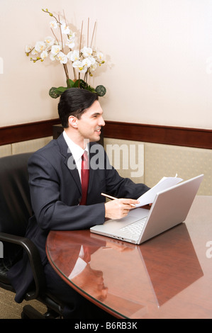 Business man sitting in front of the conference table Stock Photo