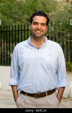 Happy Middle Eastern man hands in pockets Stock Photo