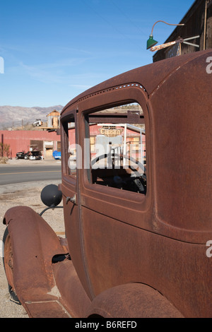 Rusted old 1920s Ford sedan in the Mojave Desert living ghost town of Randsburg California. Stock Photo