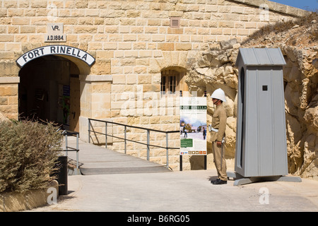 Soldier on sentry duty standing outside entrance to Fort Rinella, Kalkara, Malta Stock Photo