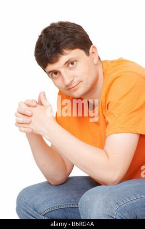 young man sitting on the floor Stock Photo