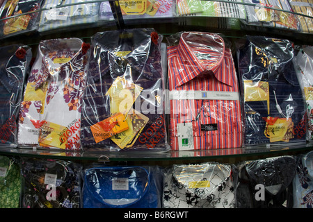 Counterfeit, fake Armani, polo and other brand name button up mens shirts on sale without regulation in Guangdong China . Stock Photo