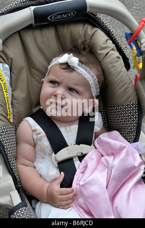 American baby girl sitting in a car seat Stock Photo