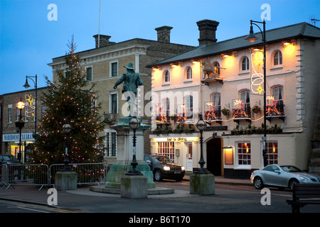 Dusk in St Ives Golden Lion Town Hall Christmas Tree and statue of Oliver Cromwell on Market Hill Stock Photo