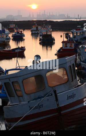 Evening sunset dusk over Paddys Hole harbour on the South Gare of the River Tees at Teesmouth near Redcar Teesside Stock Photo