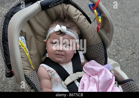 American baby girl sitting in a car seat Stock Photo