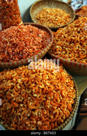 Baskests of dried shrimp for sale at an asian market in Vietnam Stock Photo