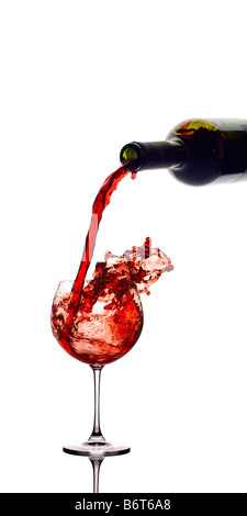 Red wine pouring down from a wine bottle Stock Photo