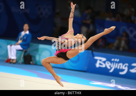 Aug 23, 2008; Beijing, China; Rhythmic gymnast Evgenia Kanaeva/Russia stag leaps with rope to win gold at 2008 Beijing Olympics. Stock Photo