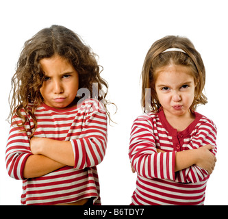 two little girls in quarrel isolated on white Stock Photo