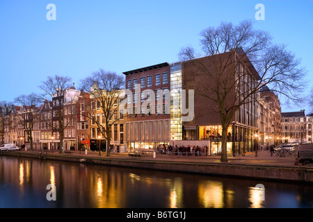 Anne Frank Huis, House and Museum on the Prinsengracht Canal in Amsterdam, the Netherlands; Holland. At dusk in winter. Stock Photo