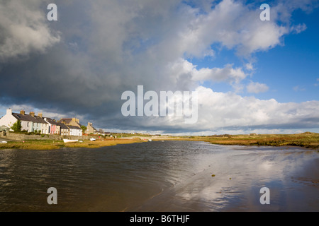 View along tidal Afon Ffraw River to village on west coast. Aberffraw Anglesey North Wales UK Britain Stock Photo