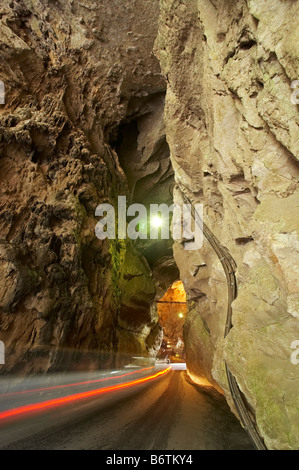 Car Tail lights and Road Through Grand Arch Jenolan Caves Blue Mountains New South Wales Australia Stock Photo
