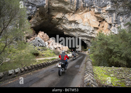 Motorbikes on Road Through Grand Arch Jenolan Caves Blue Mountains New South Wales Australia Stock Photo