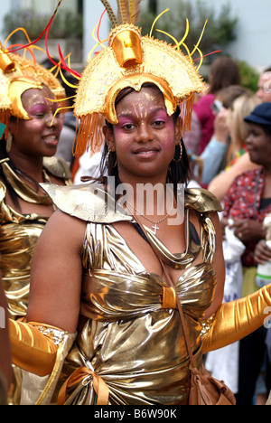 female woman black ethnic caribbean dancer smiling notting hill carnival festival street theatre london england uk europe Stock Photo