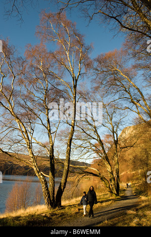 people walking along the Elan Valley trail public footpath Powys mid wales January 2009 Stock Photo