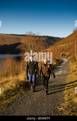 people walking along the Elan Valley trail public footpath Powys mid wales January 2009 Stock Photo