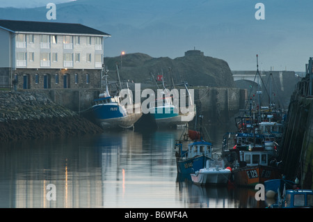 Fishing boats moored in the harbour Aberystwyth Ceredigion west wales UK at dusk Stock Photo
