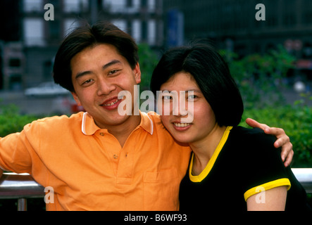 Chinese man, Chinese woman, man, woman, couple, eye contact, front view, portrait, The Bund, Waitan, Shanghai, Shanghai Municipality, China Stock Photo