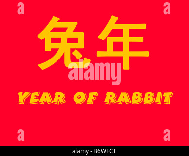 Year of the RABBIT in yellow Chinese and English text with red background Stock Photo