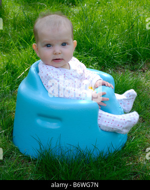 Five month old baby sitting in a bumbo baby seat Stock Photo