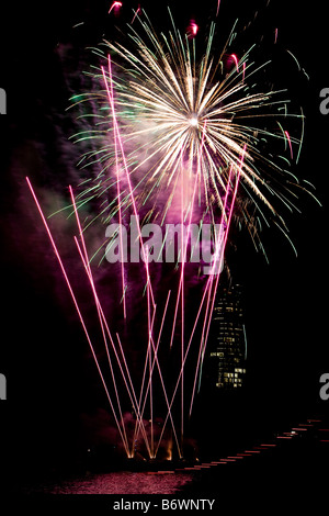 Firework display over a river Stock Photo