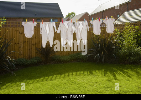 Baby clothes on clothes line Stock Photo