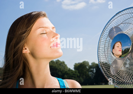 Young woman with fan Stock Photo