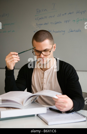 Guy concentrating on his studies Stock Photo